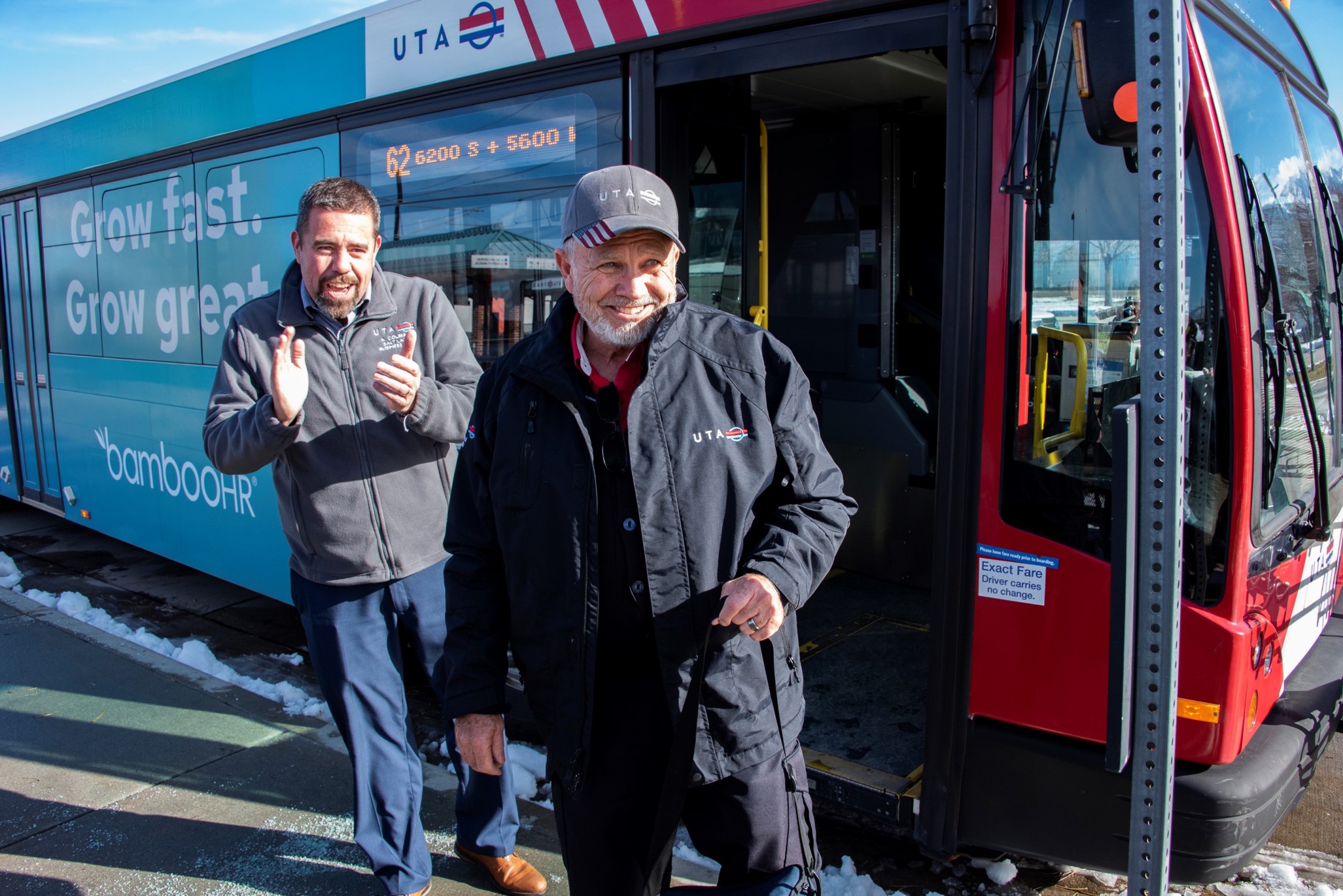 Dale Brady standing in front of bus 